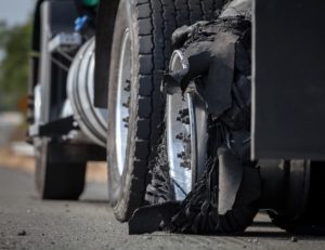 Blown tire causes truck accident